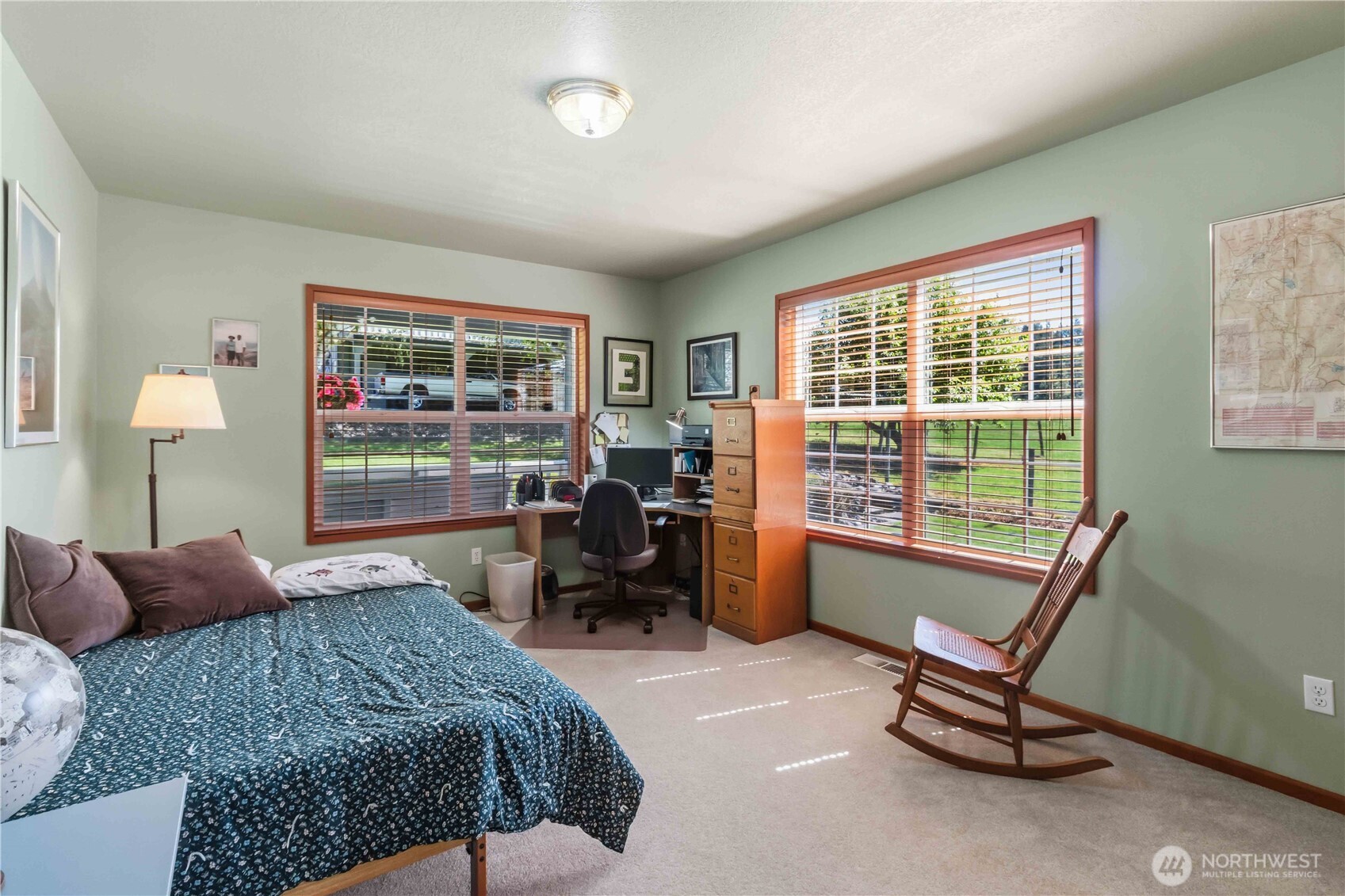 359 Frank Smith Road Toutle, WA 98649 - Photo 17 of 40 a bedroom with a bed a chair and next to a window