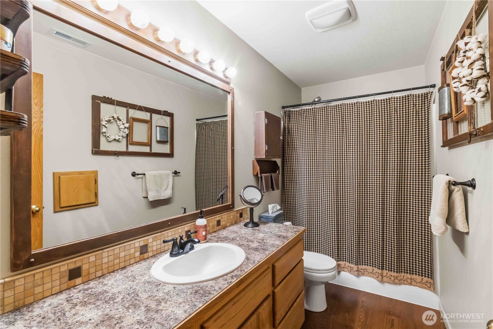 359 Frank Smith Road Toutle, WA 98649 - Photo 24 of 40 a bathroom with a granite countertop sink toilet and shower