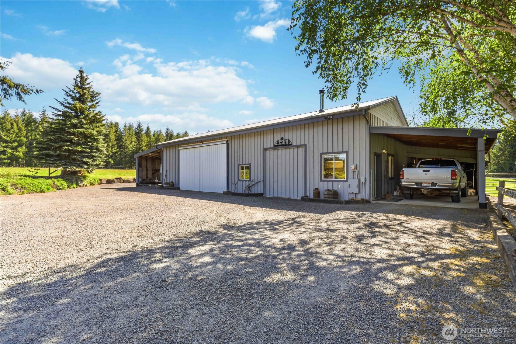 359 Frank Smith Road Toutle, WA 98649 - Photo 29 of 40 a view of a house with a yard and garage