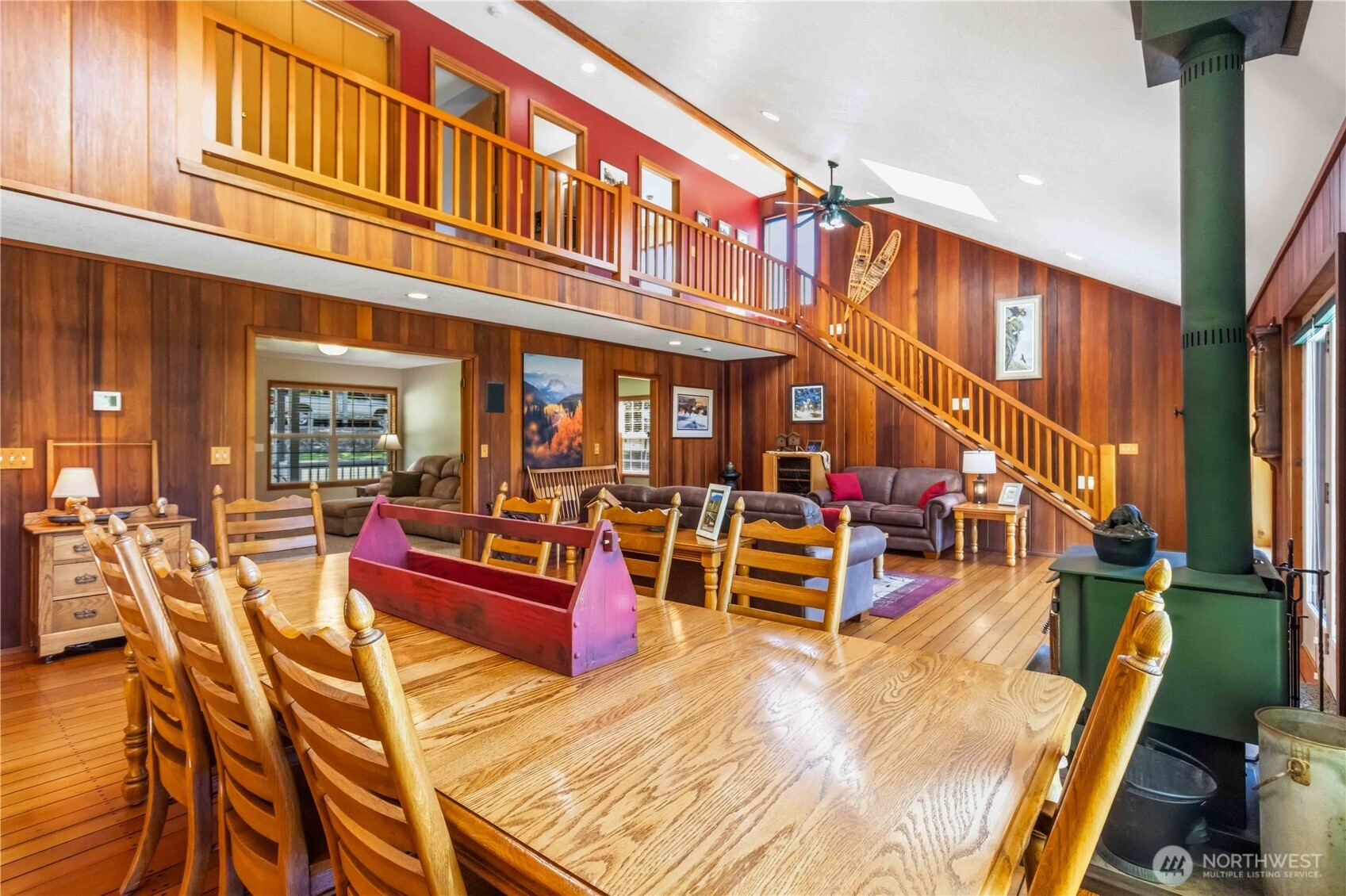 359 Frank Smith Road Toutle, WA 98649 - Photo 10 of 40 a view of a patio with dining table and chairs with wooden floor and fence