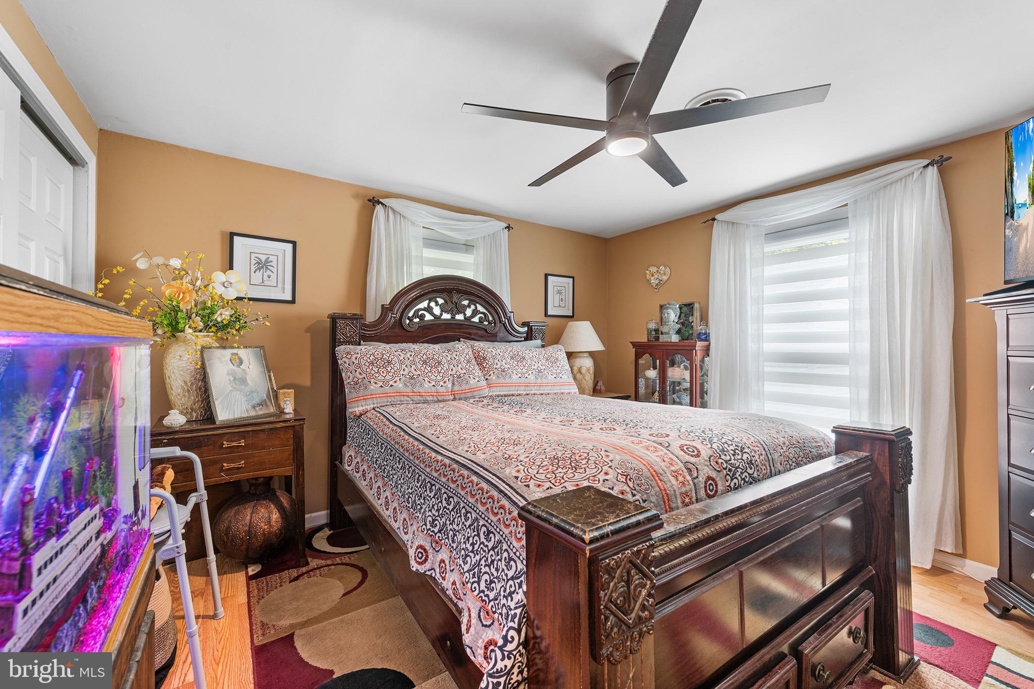 405 East Millstream Road Cream Ridge, NJ 08514 - Photo 17 of 37 a bed room with a bed and a chandelier