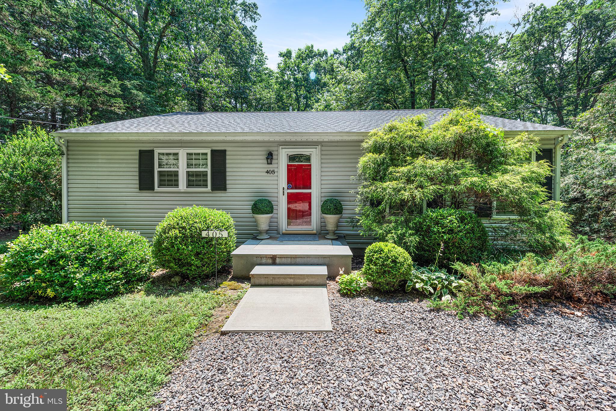 405 East Millstream Road Cream Ridge, NJ 08514 - Photo 2 of 37 a view of a house with a yard and plants