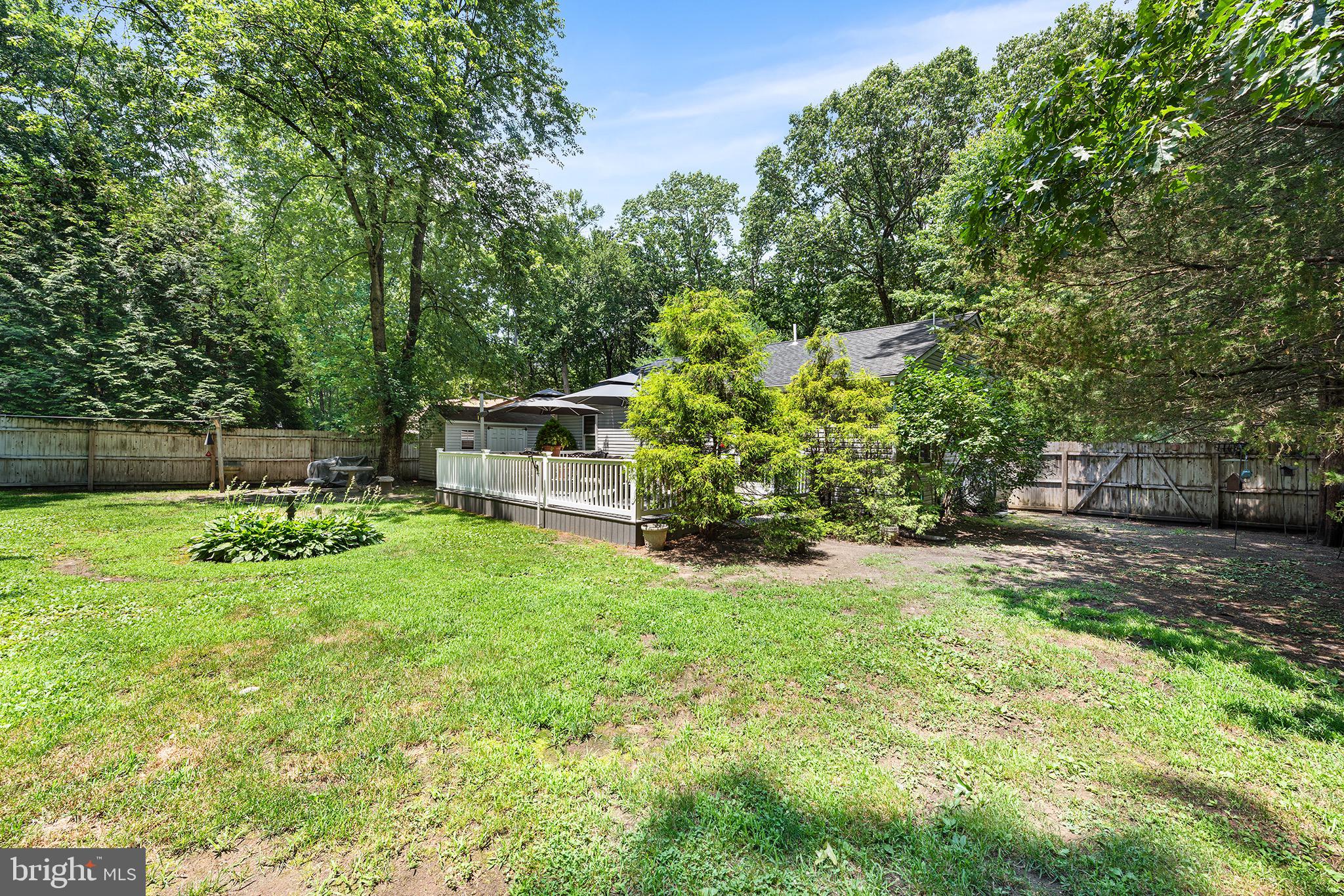 405 East Millstream Road Cream Ridge, NJ 08514 - Photo 28 of 37 a view of backyard with seating and green space