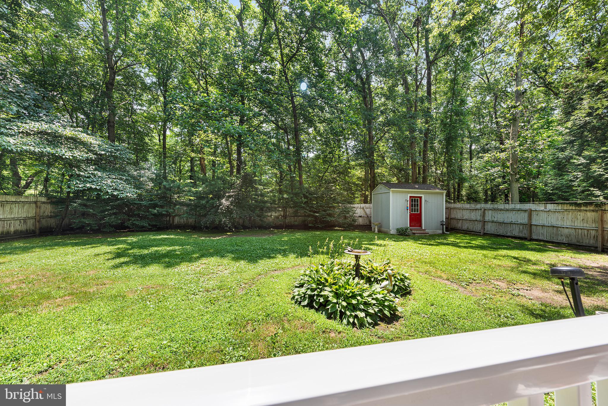405 East Millstream Road Cream Ridge, NJ 08514 - Photo 29 of 37 a backyard of a house with a yard and potted plants