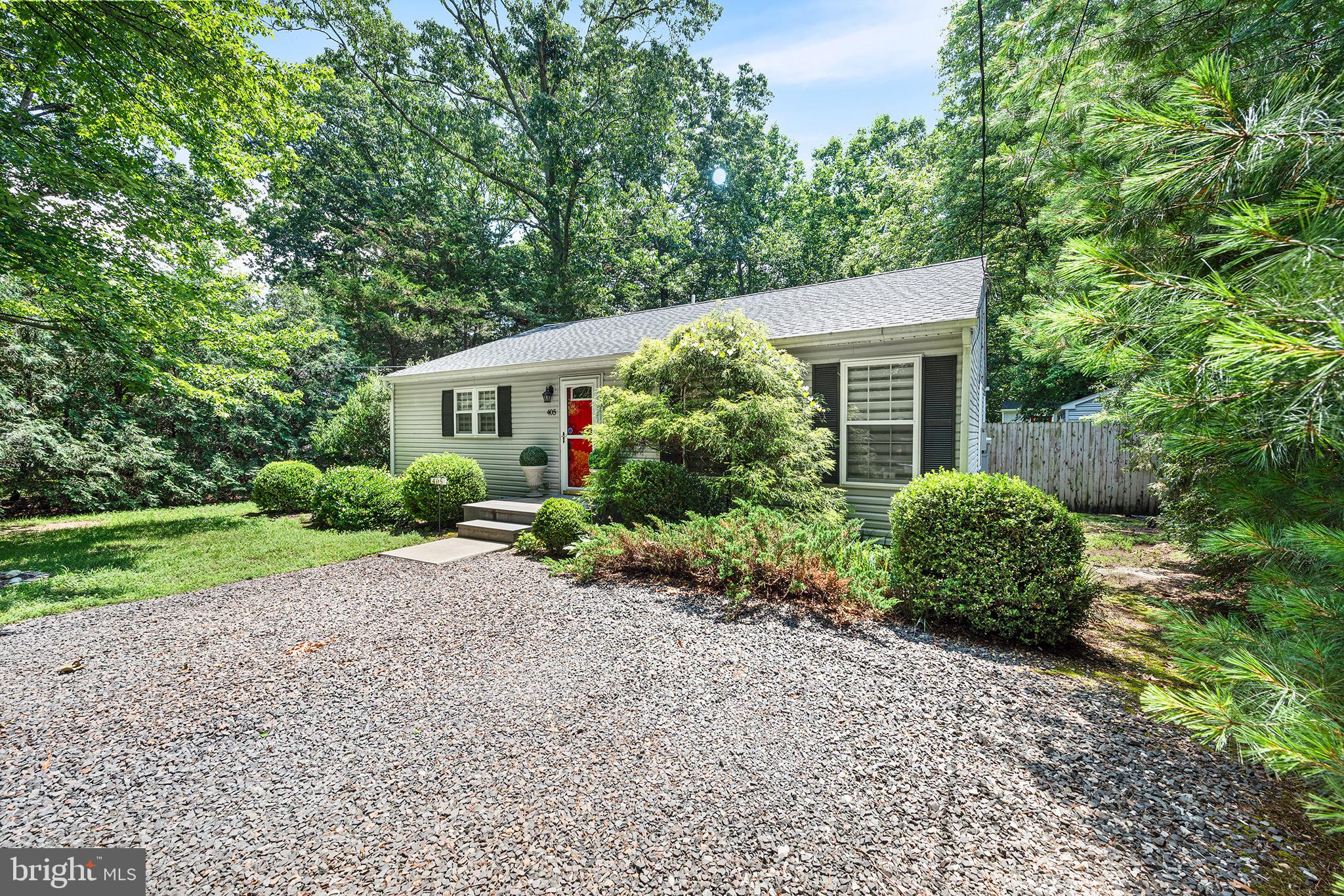 405 East Millstream Road Cream Ridge, NJ 08514 - Photo 3 of 37 a house with a tree in front of it