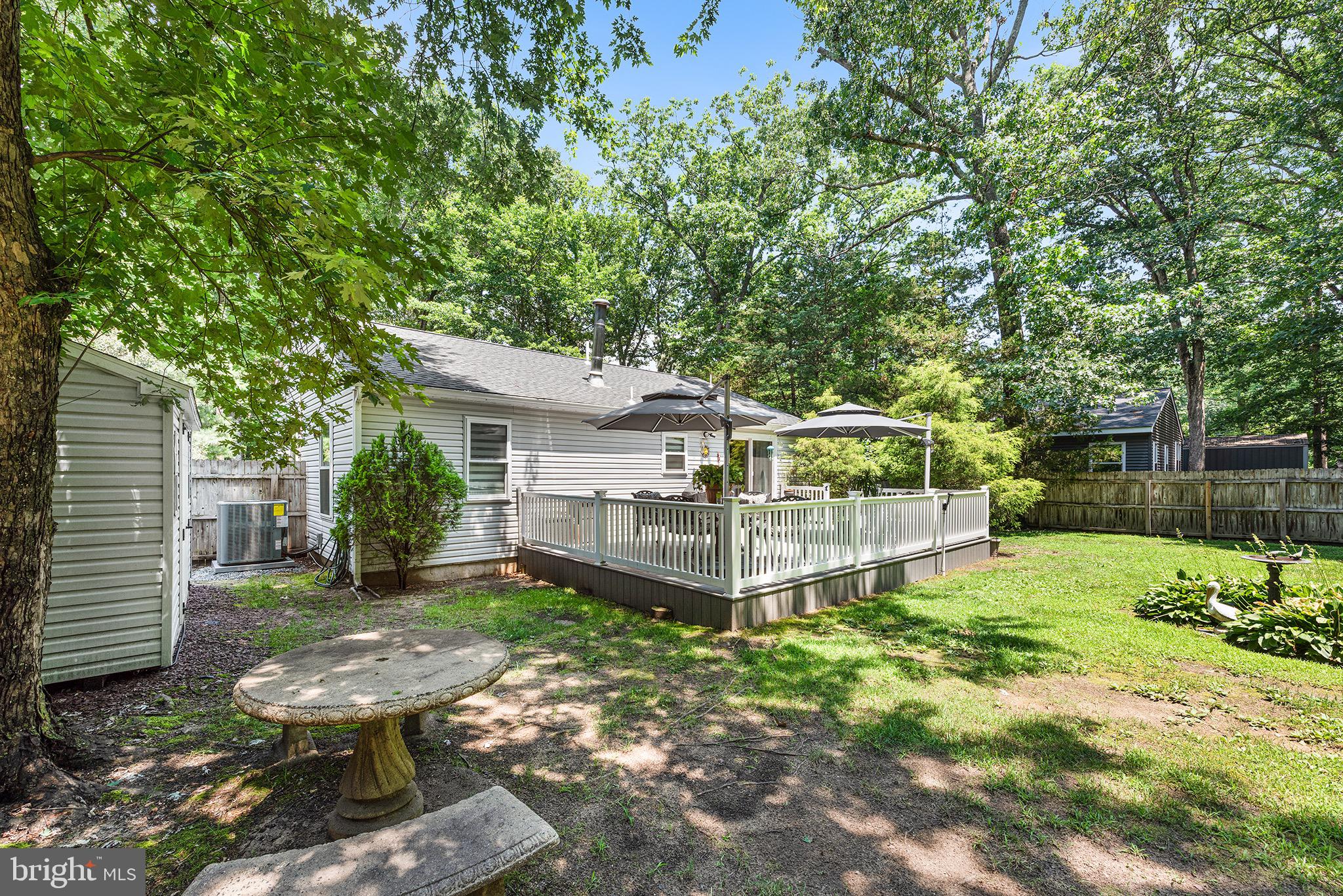 405 East Millstream Road Cream Ridge, NJ 08514 - Photo 35 of 37 a view of a house with backyard and sitting area