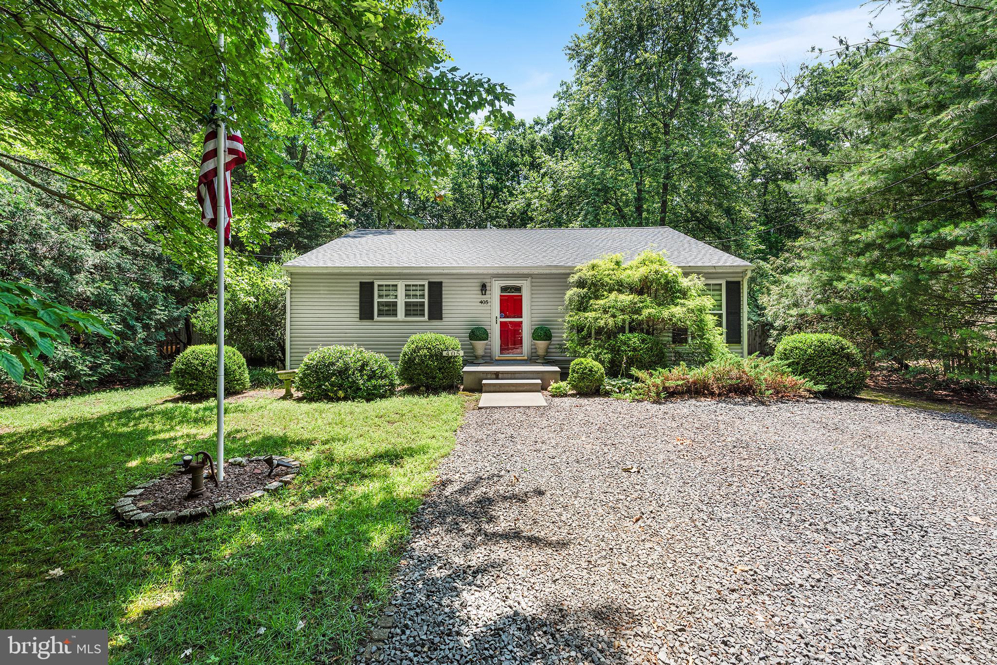 405 East Millstream Road Cream Ridge, NJ 08514 - Photo 37 of 37 a front view of a house with a yard and potted plants