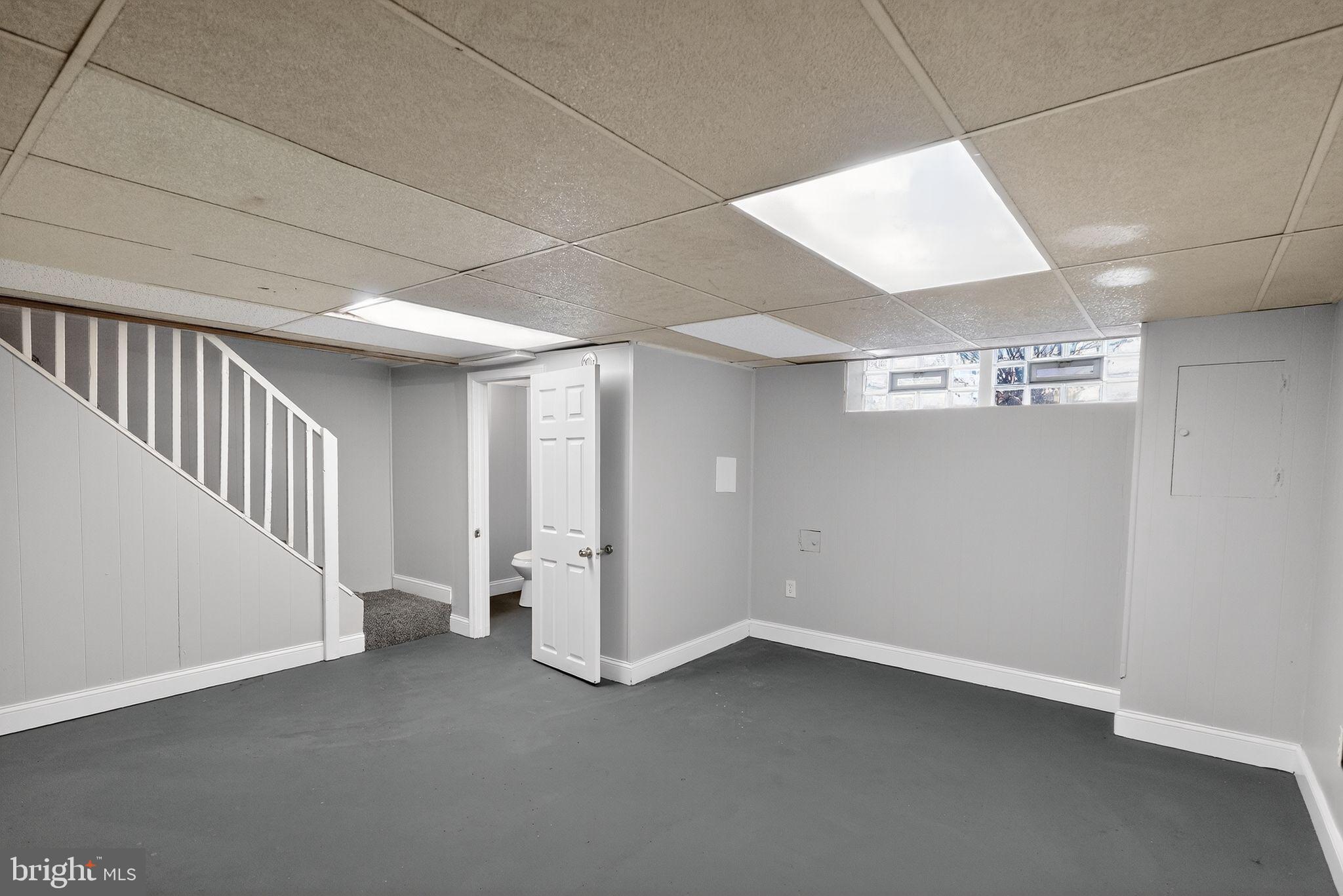 2018 Winford Road Baltimore, MD 21239 - Photo 23 of 29 wooden floor in an empty room with a window
