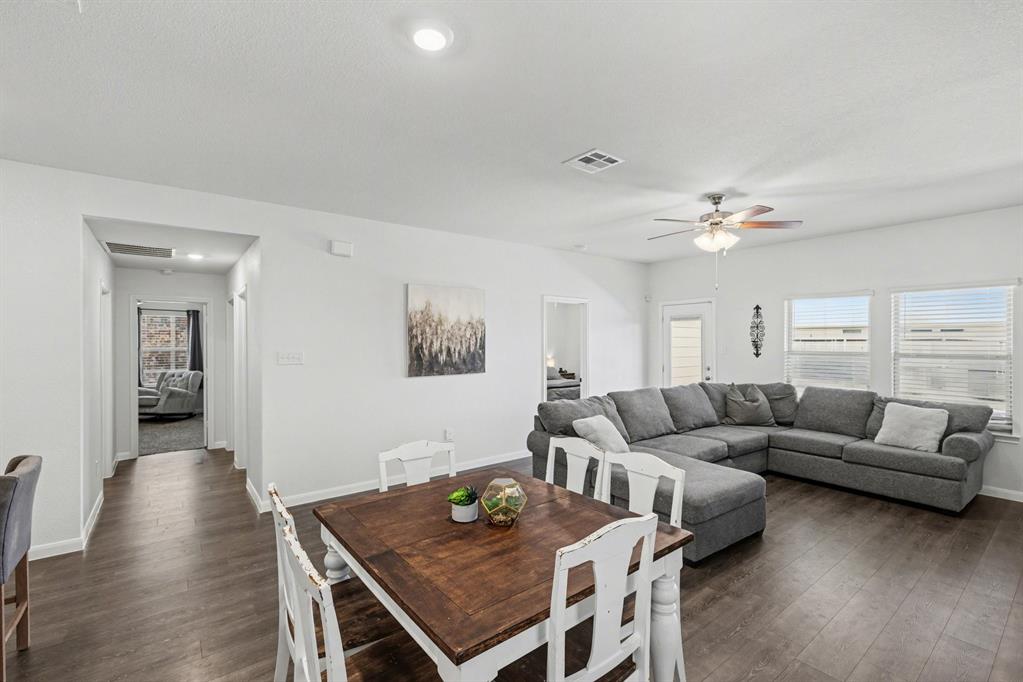 706 Spur Ridge Princeton, TX 75407 - Photo 12 of 36 Dining room with dark wood-type flooring, a ceiling fan, and recessed lighting
