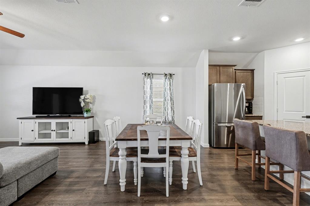 706 Spur Ridge Princeton, TX 75407 - Photo 16 of 36 Dining room featuring dark wood-style floors, ceiling fan, and recessed lighting