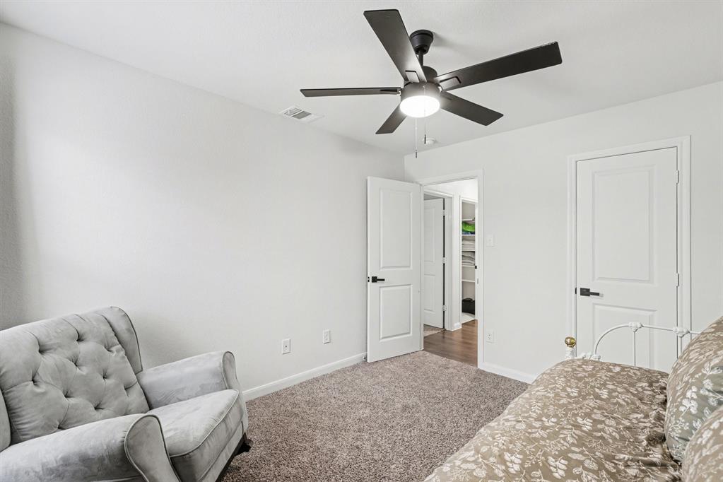 706 Spur Ridge Princeton, TX 75407 - Photo 27 of 36 Living area featuring carpet floors and ceiling fan