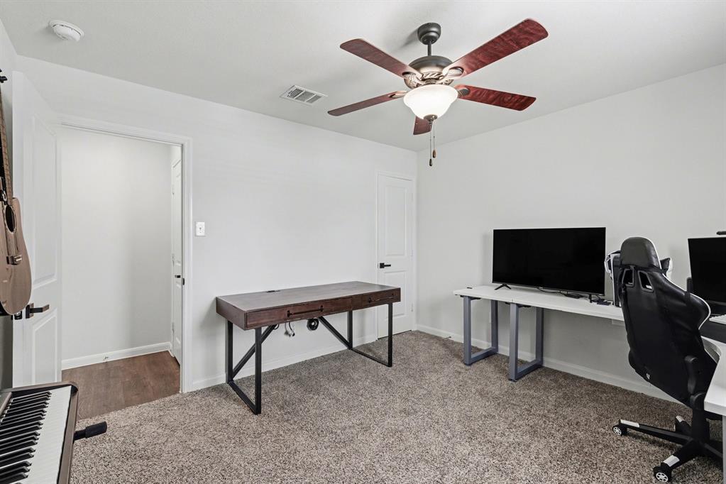 706 Spur Ridge Princeton, TX 75407 - Photo 9 of 36 Carpeted home office with baseboards and ceiling fan