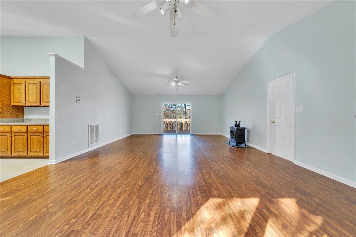 6548 Goodview Road Goodview, VA 24095 - Photo 3 of 113 a view of empty room with wooden floor