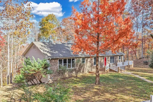 a view of a house with a yard and garage