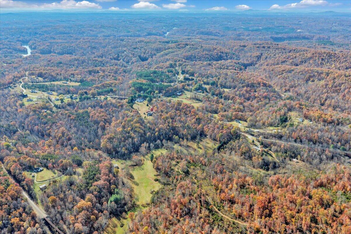 6548 Goodview Road Goodview, VA 24095 - Photo 74 of 113 an aerial view of house with yard and mountain in the background
