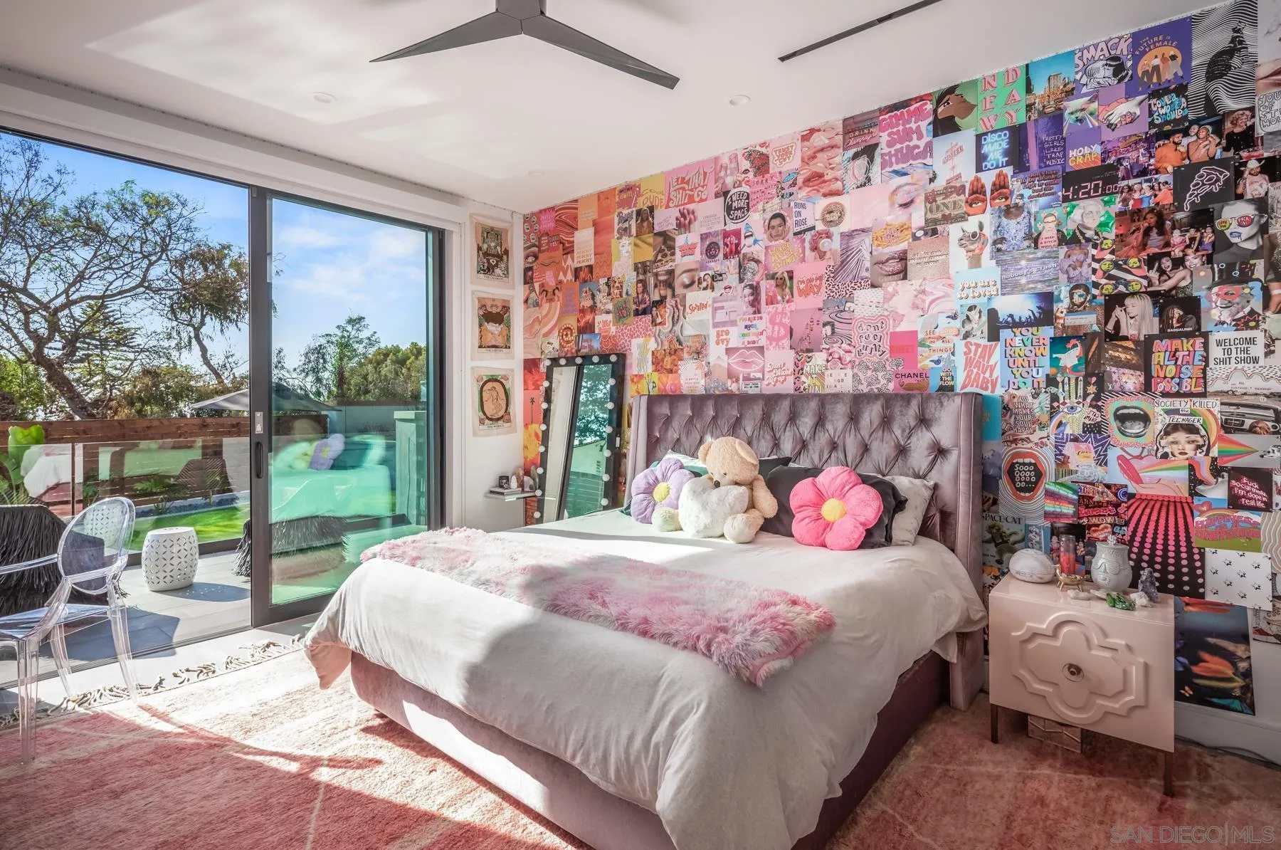 6643 Muirlands Drive La Jolla, CA 92037 - Photo 12 of 16 a bedroom with a bed and a painting on the wall
