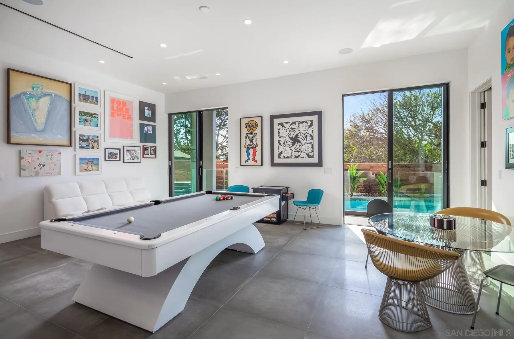 6643 Muirlands Drive La Jolla, CA 92037 - Photo 13 of 16 a living room with furniture and a large window