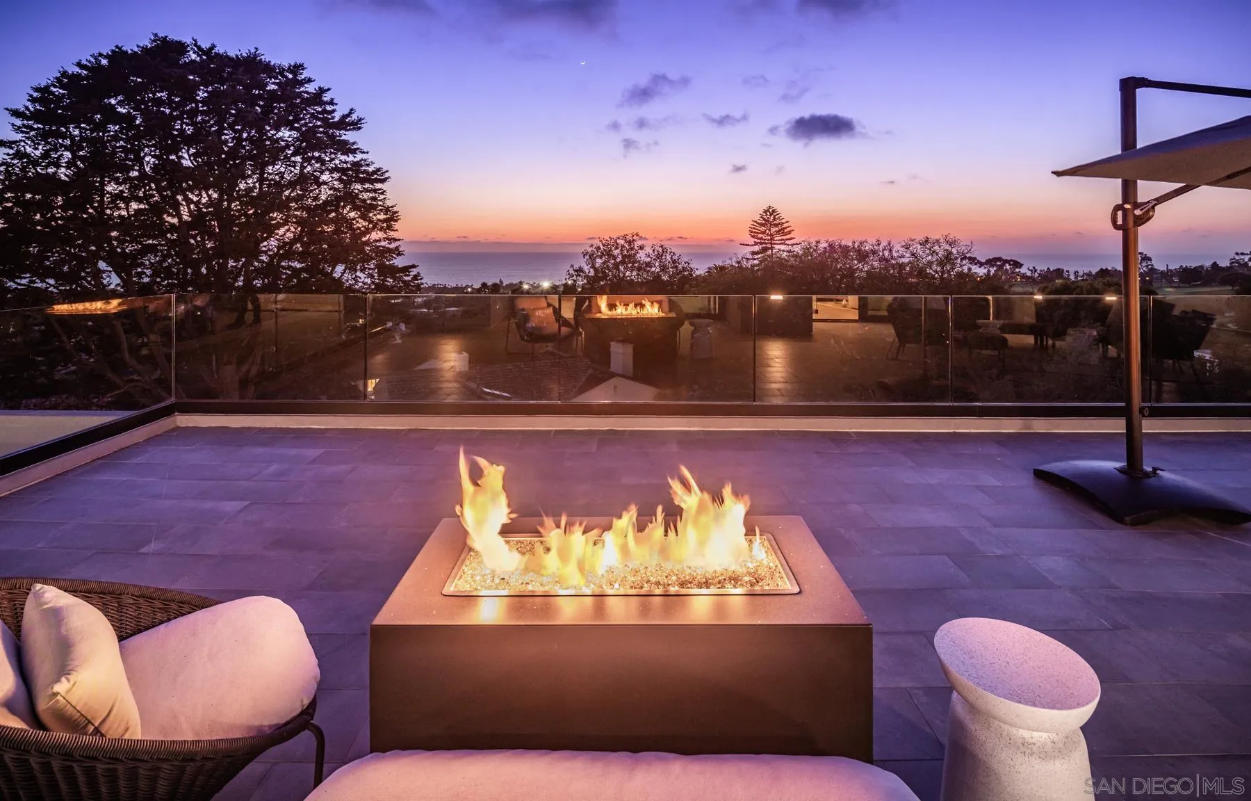 6643 Muirlands Drive La Jolla, CA 92037 - Photo 14 of 16 a view of a swimming pool with a patio and a fire pit