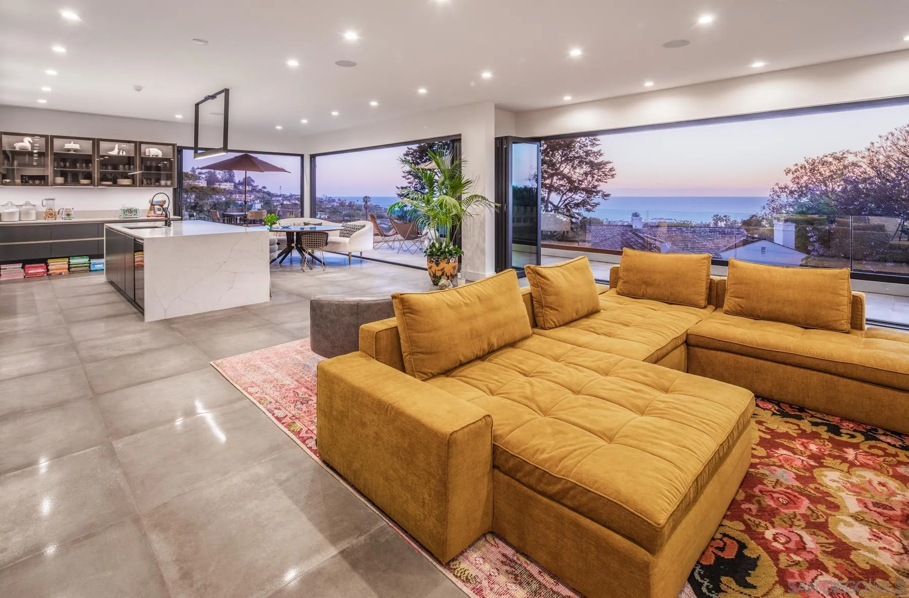 6643 Muirlands Drive La Jolla, CA 92037 - Photo 2 of 16 a living room with furniture and kitchen view