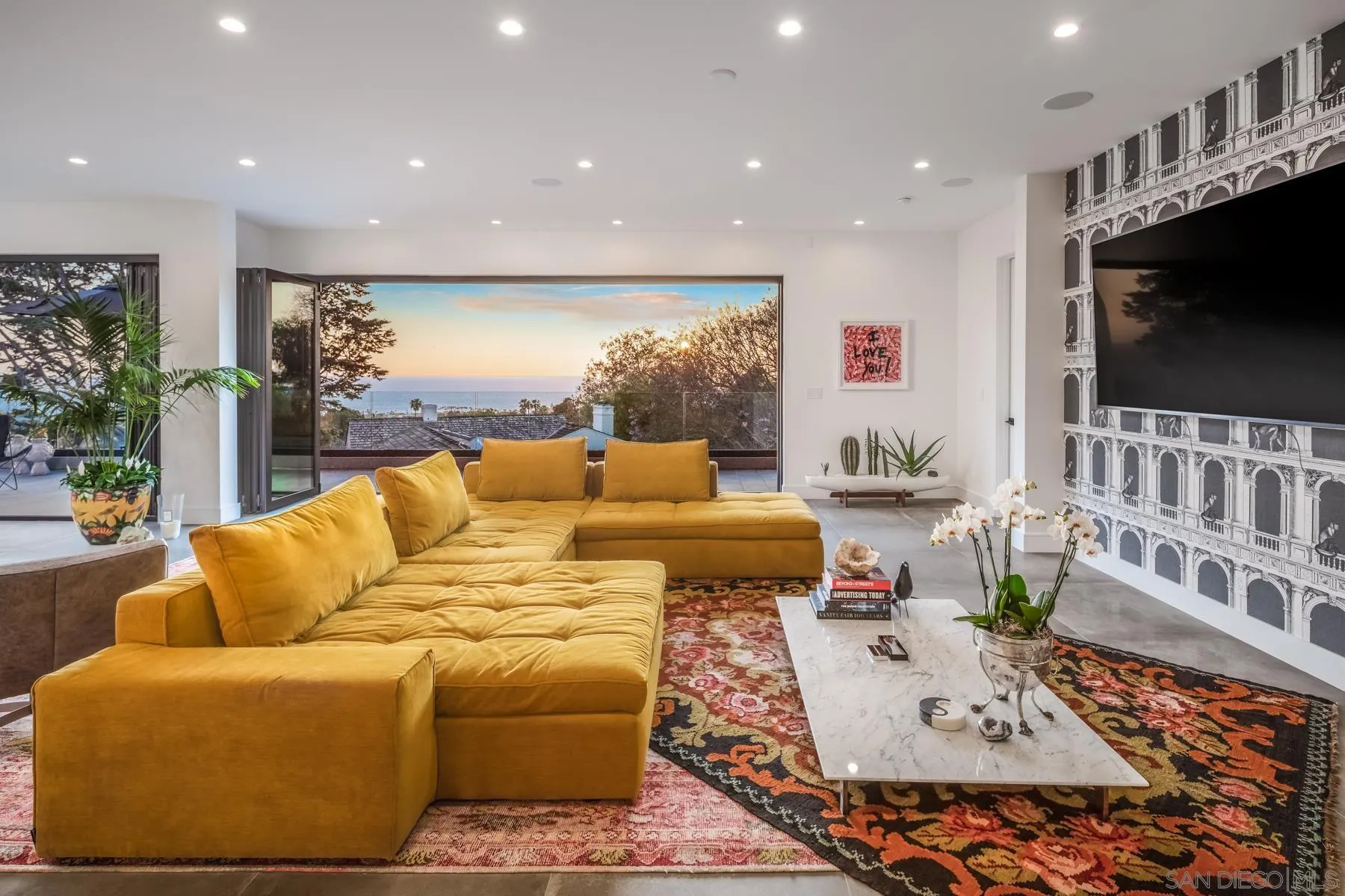 6643 Muirlands Drive La Jolla, CA 92037 - Photo 3 of 16 a living room with furniture and a flat screen tv