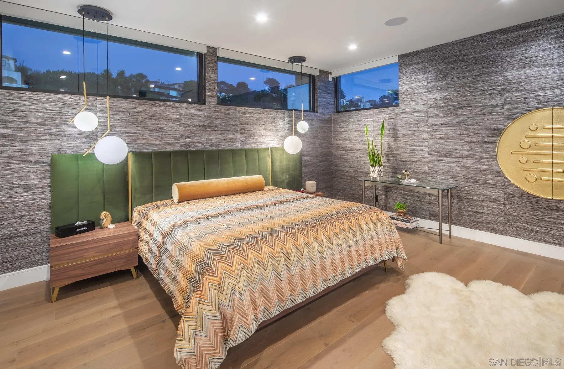 6643 Muirlands Drive La Jolla, CA 92037 - Photo 8 of 16 a bedroom with a bed and wooden floor