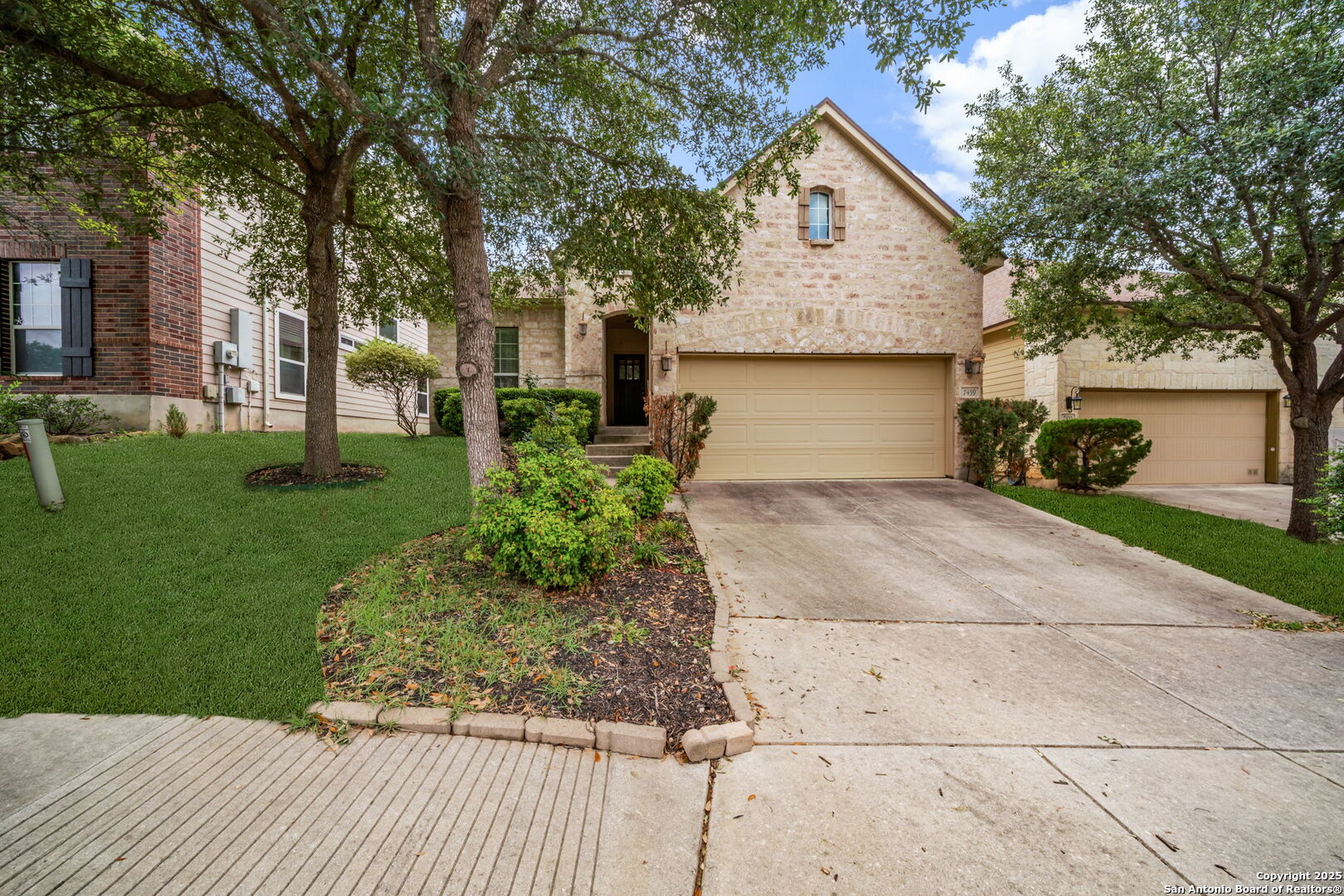 7459 Eagle Ledge San Antonio, TX 78249 - Photo 1 of 1 a front view of a house with a yard and trees