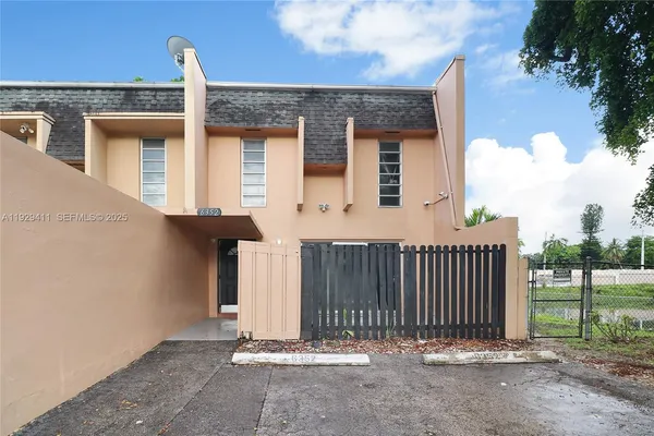front view of a house with a fence