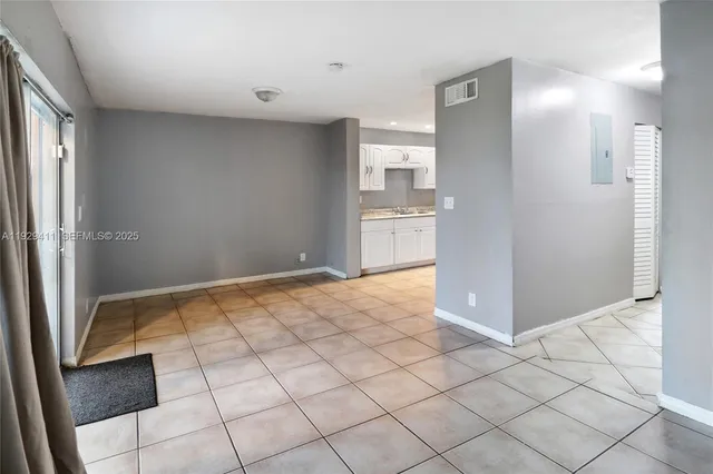 a view of a kitchen from the hallway