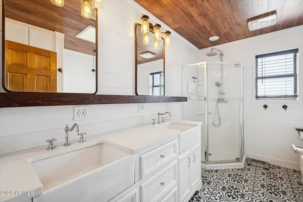 a bathroom with a sink a mirror and a bathtub