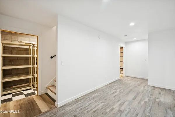 a view of a storage and utility room with washer and dryer