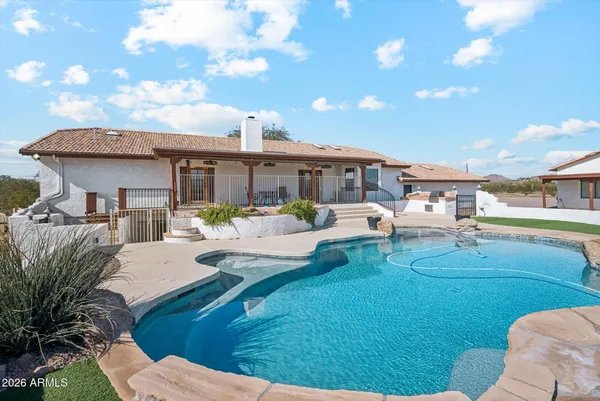 a view of a swimming pool with lounge chair