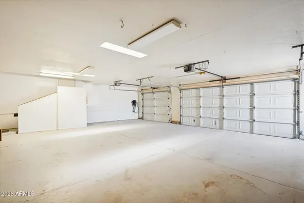 a view of backyard with garage