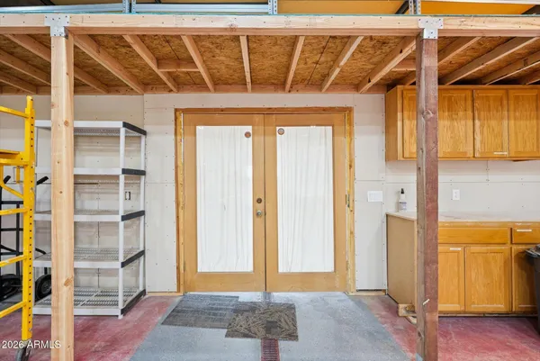 a view of a room with wooden ceiling
