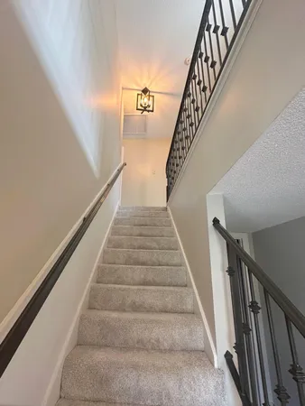a view of a hallway with windows