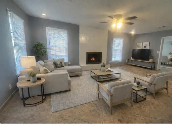 a living room with furniture and a flat screen tv
