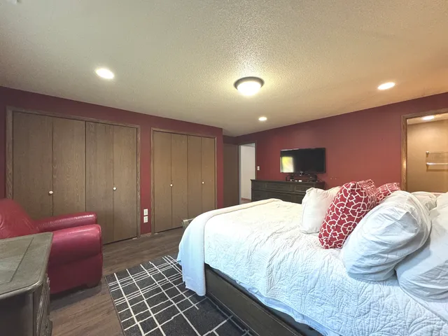 a bedroom with a bed and a view of bathroom