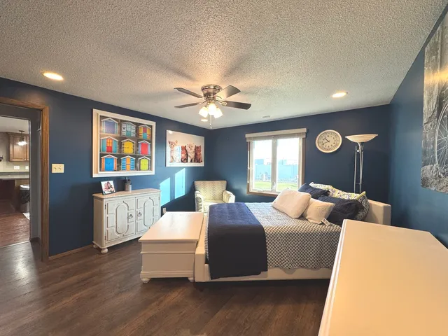 a bed room with bed and window