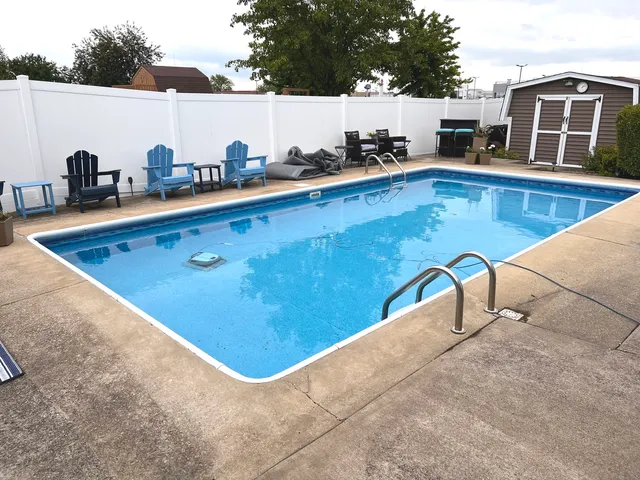a view of a swimming pool with a lounge chairs