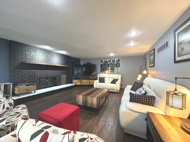 a bedroom with furniture and a fireplace