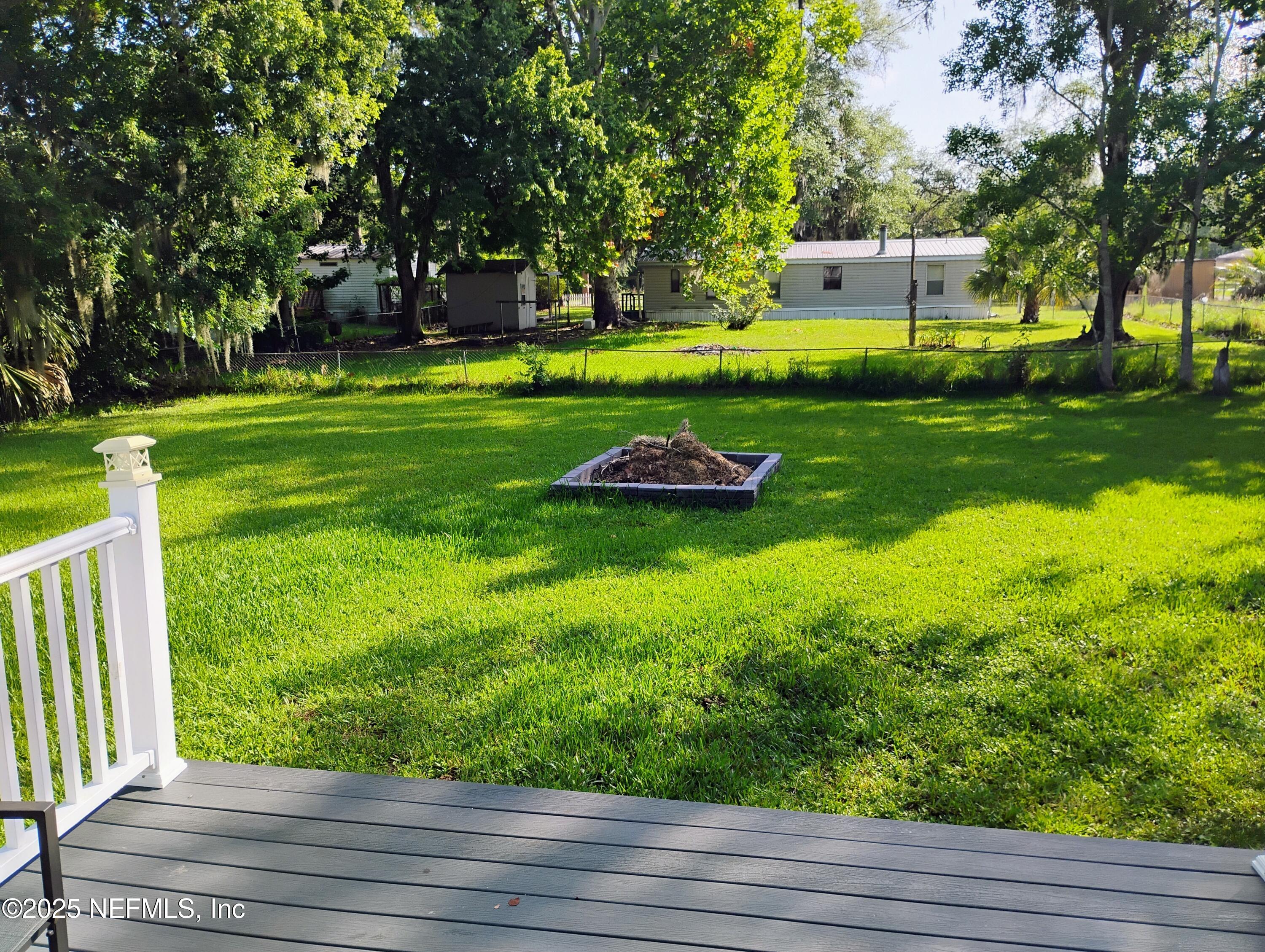 122 Culpepper Road San Mateo, FL 32187 - Photo 4 of 15 a view of a park with large trees