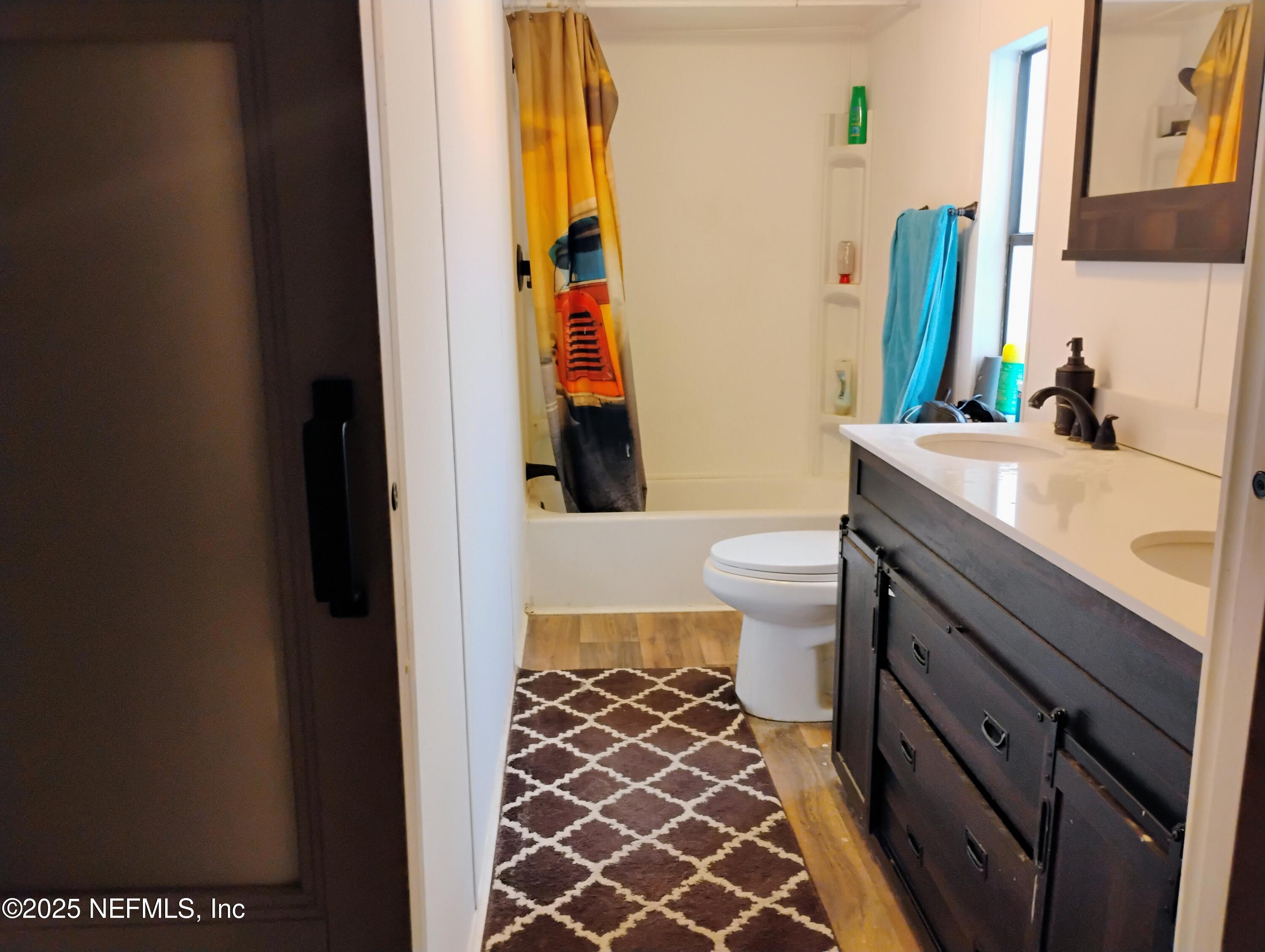 122 Culpepper Road San Mateo, FL 32187 - Photo 9 of 15 a bathroom with a sink and a mirror