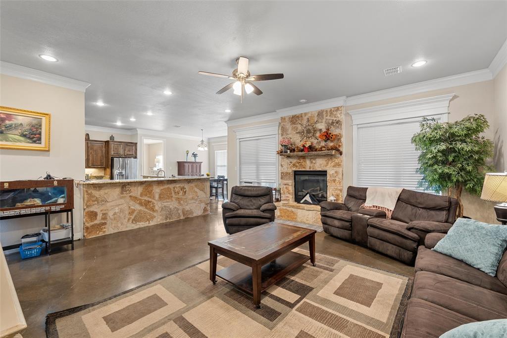 2370 Garrett Lane China Spring, TX 76633 - Photo 12 of 36 a living room with furniture a fireplace and a flat screen tv