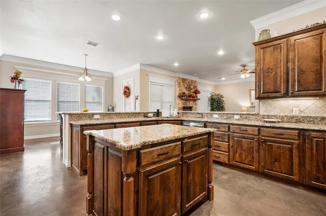 a kitchen with a stove and a sink