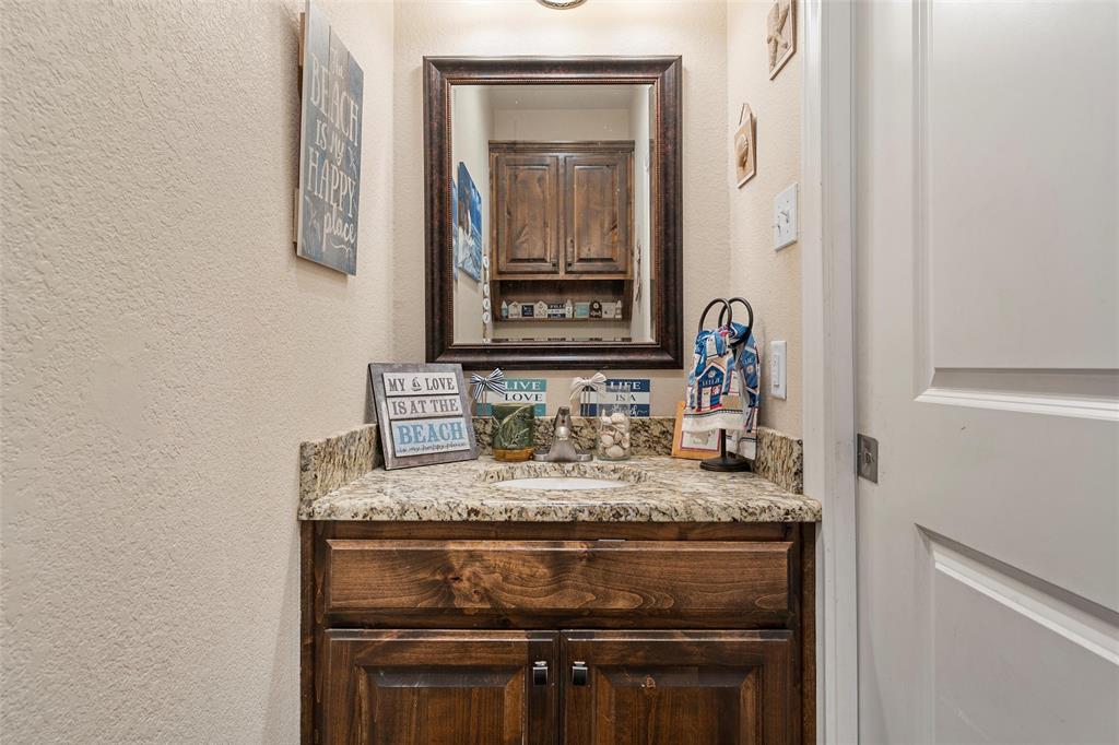 2370 Garrett Lane China Spring, TX 76633 - Photo 19 of 36 a bathroom with a sink and a mirror