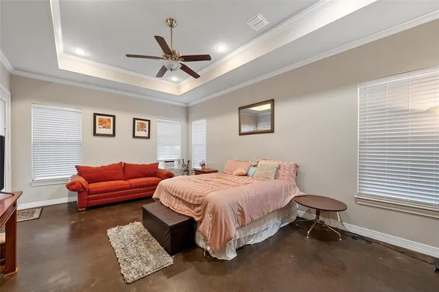 a bedroom with a bed and a couch