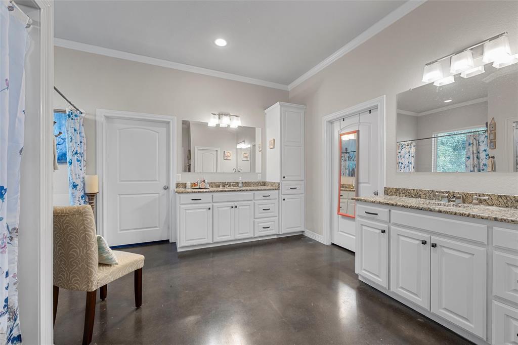 2370 Garrett Lane China Spring, TX 76633 - Photo 22 of 36 a large bathroom with a large mirror vanity and a sink