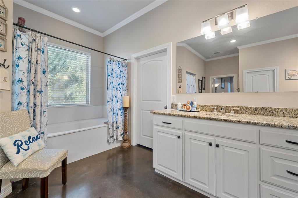 2370 Garrett Lane China Spring, TX 76633 - Photo 23 of 36 a bathroom with a granite countertop sink mirror and a bathtub