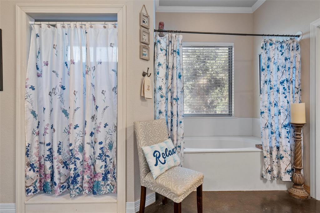 2370 Garrett Lane China Spring, TX 76633 - Photo 24 of 36 a bathroom with a bathtub and shower
