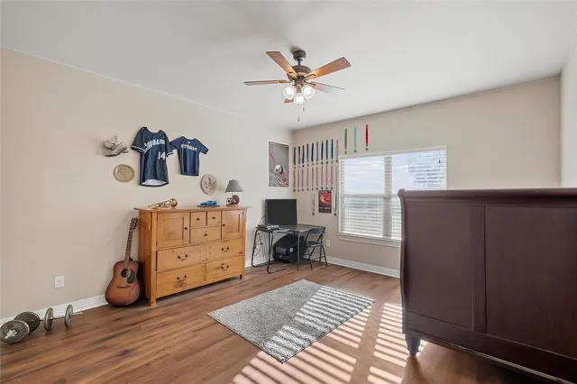 a bedroom with furniture and a window
