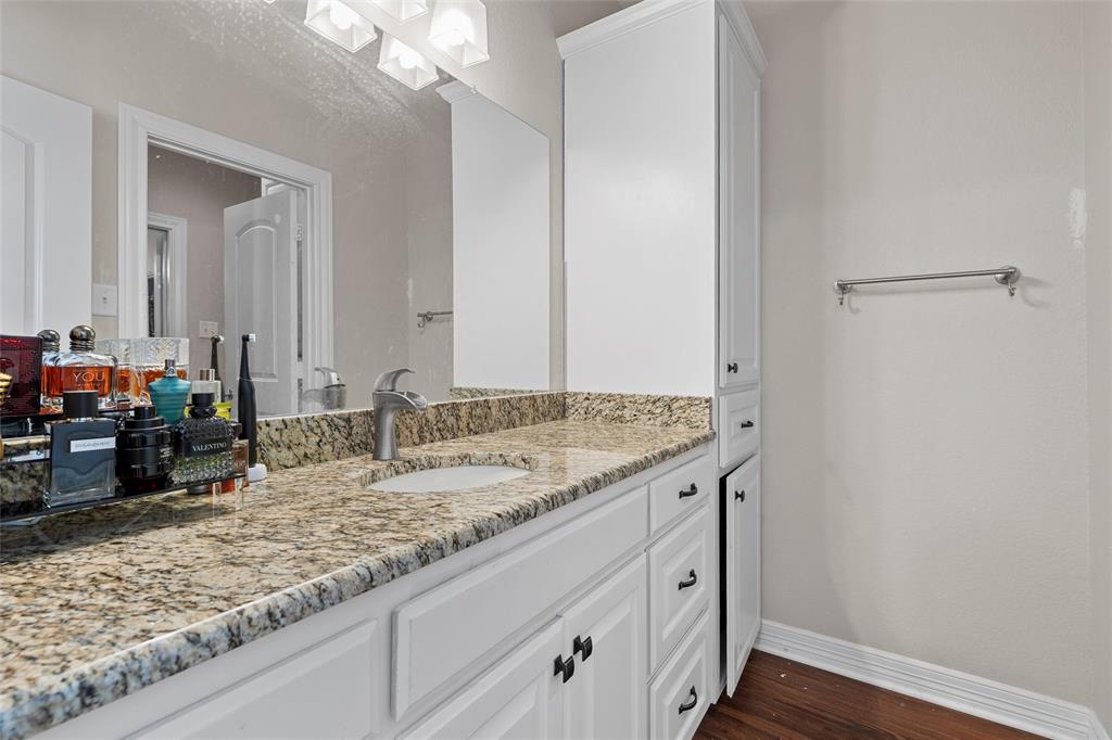 2370 Garrett Lane China Spring, TX 76633 - Photo 29 of 36 a bathroom with a granite countertop sink and a mirror